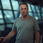 A man looking confused while wondering if its better to get hair transplants in turkey or america